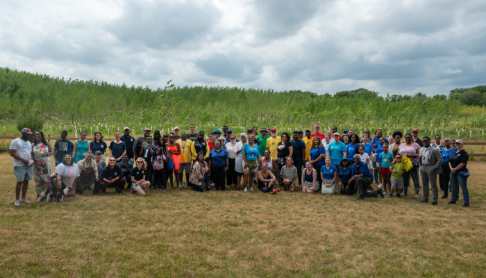 Group photo of attendees outdoors at Eastwick Community Day