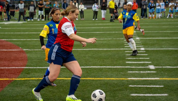 Two women compete in the 2024 International Unity Cup's Women's Tournament.
