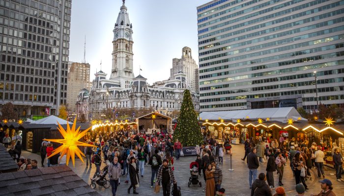 Holiday shoppers explore Christmas Village in Love Park.