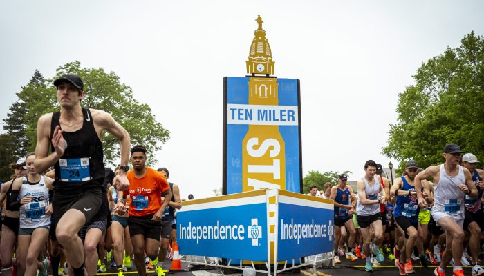 Runners start the 10-mile race as they cross the starting line.