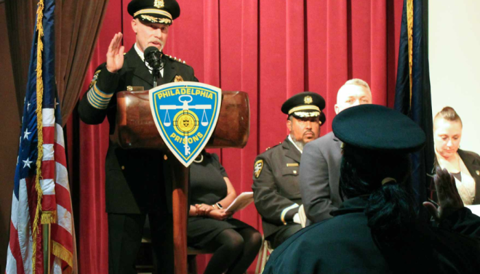 Prisons Commissioner, Michael Resnick, swearing in new class of correctional officers.